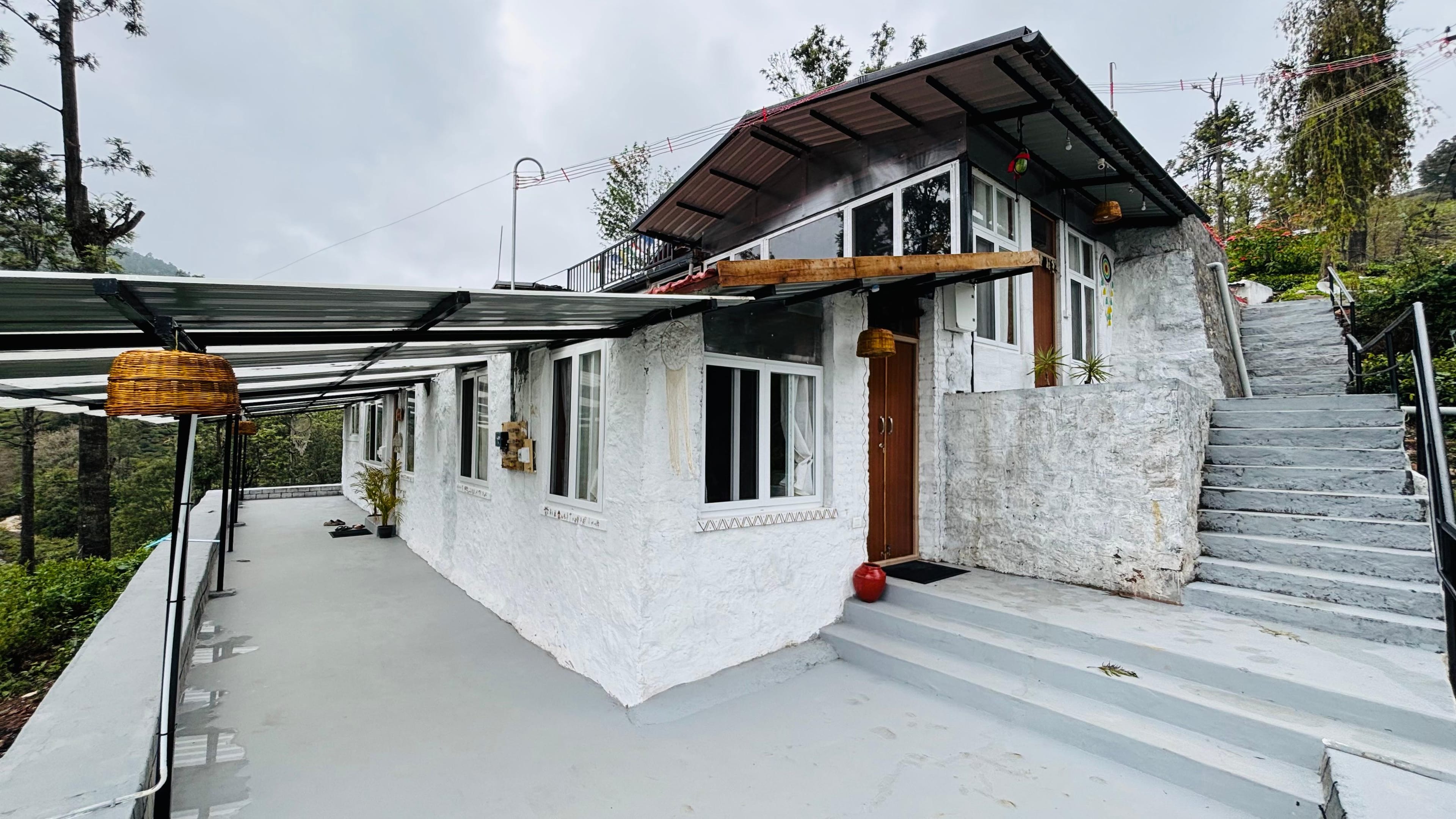 Front view of the hundred-year-old heritage bungalow surrounded by gardens